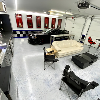 Modern Garage With Bar Stools, Cabinets, and Lounge Seating - Bruce