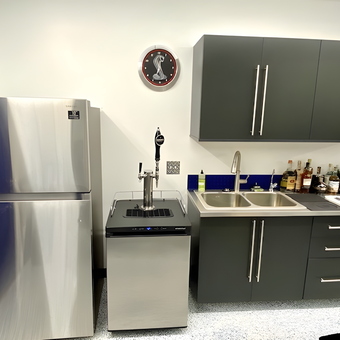 Modern Garage Bar with Stainless Appliances and Cabinets - Bruce