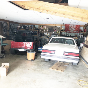 Organized garage with classic cars, ladders, and tool storage - Chad from Elkton, MD