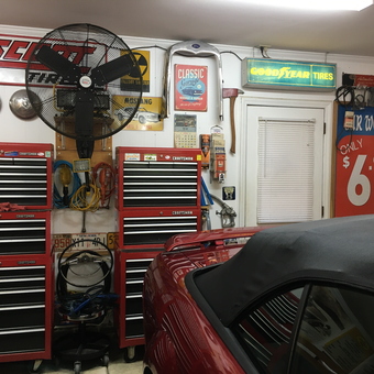 Organized garage with tool chests, fan, and signs - Chris from Huntersville, NC