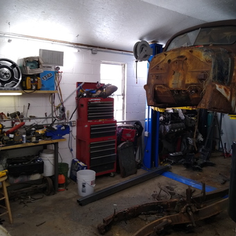 Home garage with car lift, toolboxes, and workbench - Missy from Brookville, IN