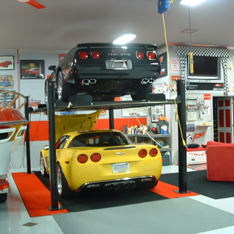 Garage with Car Lift, Corvettes, Decor and Boat - 2008 Vette