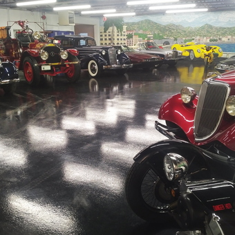 Classic Cars and Vintage Motorcycle Display in Garage - Dan