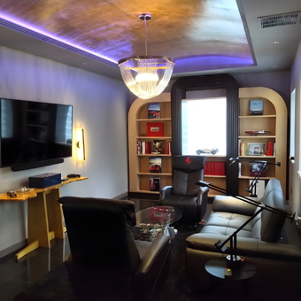Luxury Garage Lounge With Leather Seating and Car Decor - Dan