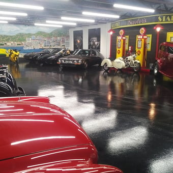 Classic Cars and Vintage Gas Pumps in Showroom - Dan