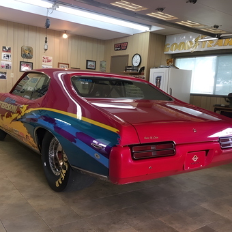 Colorful classic muscle car in custom garage - Art from Rialto, CA
