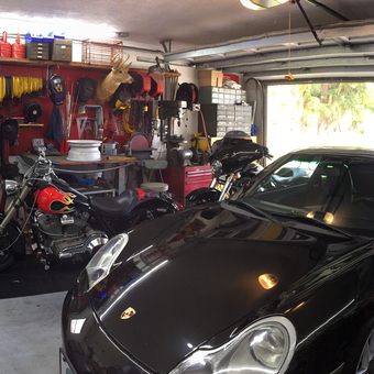 Organized garage with tools, motorcycles, and Porsche - Max from Edgewater, FL