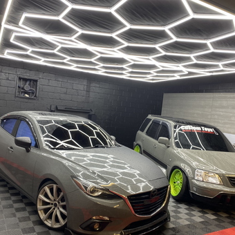 Modern garage with LED hex lighting and two cars - Red Level Car Wash from new castle, DE