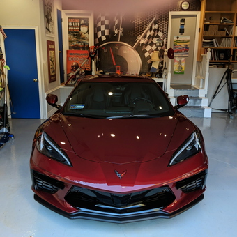 Organized garage with red Corvette and wall decor - Gillespie from Novato, CA
