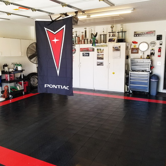 Organized garage with Pontiac flag and floor tiles - JOE from West Palm Beach, FL