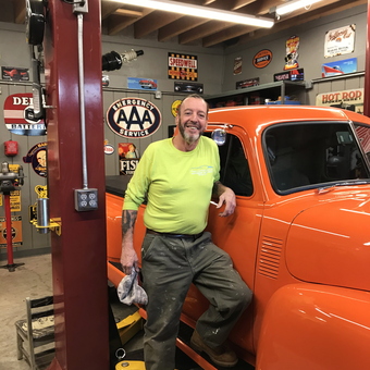 Classic Car Garage With Orange Truck And Vintage Signs - Uncle Joe from Bronx, NY