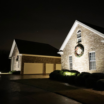 Brick garage with three doors and holiday wreaths - Rick from Harvest, AL
