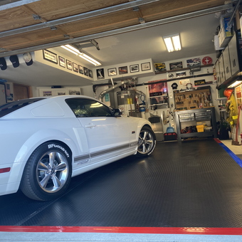 Organized garage with white Mustang, cabinets, tool chest - Salty Dog from Pine Mountain Club, CA