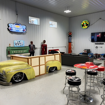Retro Garage Lounge with Car Bar and Neon Signs - Mike