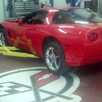 Red Corvette on Lift with Garage Stools - Royce from Kempner, TX