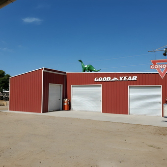 Red metal garage with vintage signs and dinosaur - Daniel from Queen Creek, AZ