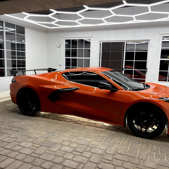 Modern garage with LED lighting and sports car - Lenny