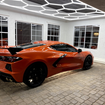 Modern garage with LED ceiling lights and sports car - Lenny