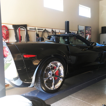 Garage Car Lift with Black Corvette and Wall Storage - Roger from LOVELAND, CO