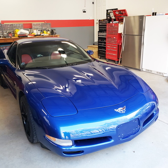 Organized garage with blue Corvette and tool storage - Perry from Wake Forest, NC