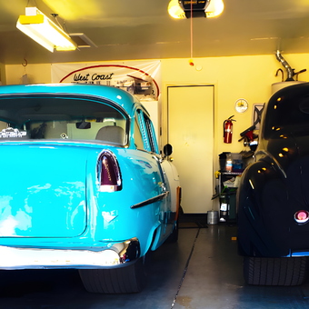Classic Cars in Organized Garage with Banners - Hank from Santa Ynez