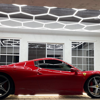 Modern garage with LED hexagon lighting and red sports car - Lenny from Peoria, AZ