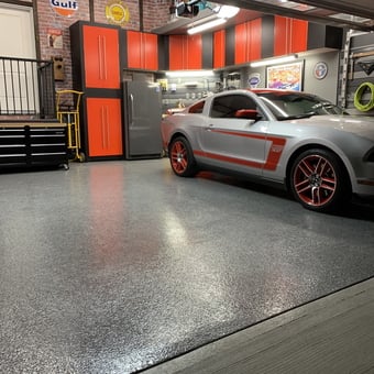 Modern garage with red cabinets and Mustang - Jim from Okotoks Canada