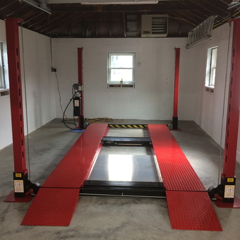Red Four Post Car Lift in Clean Garage - MAC from Haskell, NJ