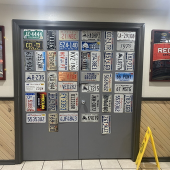 Wall Display of Vintage License Plates and Racing Decor - Angela from Bells, TX