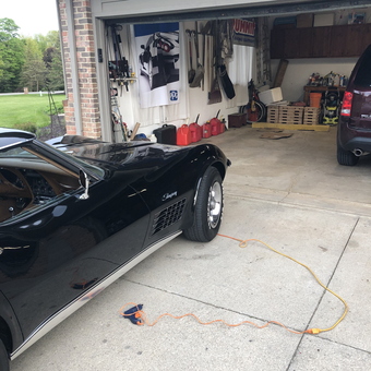 Organized garage with classic car, tools, and banners - Big Lew from Medina, OH