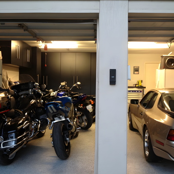 Organized garage with motorcycles, sports car, and cabinets - David from Arlington, TX