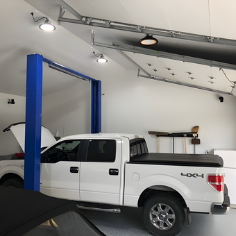 Modern Garage with Car Lift, Truck, and Storage - team15racing