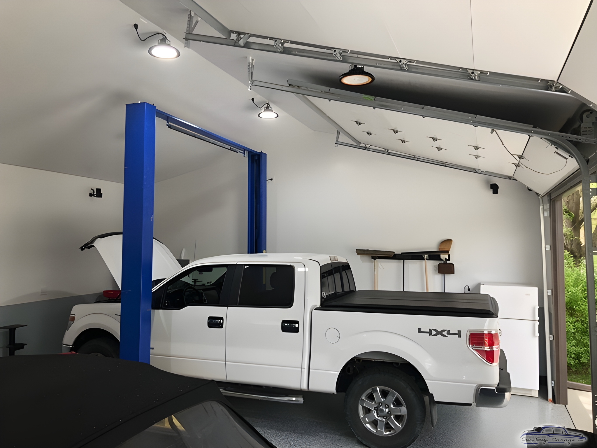 Modern Garage with Car Lift, Truck, and Storage - team15racing