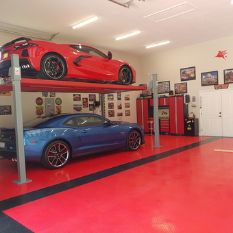Custom Garage With Car Lift, Cabinets, Wall Art - Miller from Florida, FL