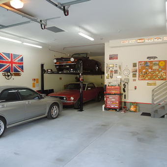 Organized garage with car lift, tool chest, and wall decor - Dave from Elkhorn, NE