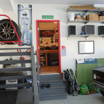 Organized garage with tire rack, shelving, and car parts - Dave from Elkhorn, NE