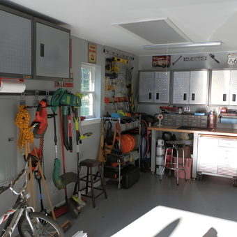 Organized garage with cabinets, workbench, and tool storage - Bernie from Cleburne, TX