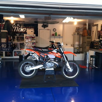 Motocross Garage with Blue Epoxy Floor and Tool Storage - J from Hollister, CA