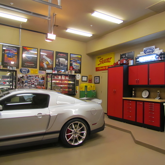 Organized garage with red cabinets and collectibles - Bob from Paradise Valley, AZ
