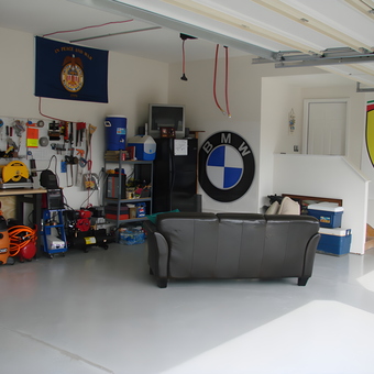 Organized Garage With Workbench, Tools, and Car Decor - D Walsh