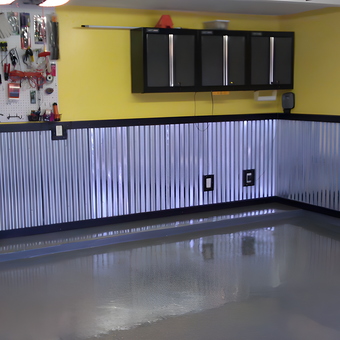 Organized Garage With Metal Wainscoting and Cabinets - Hugh