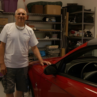 Organized garage with metal shelving and red convertible - Thad from Uniontown, PA