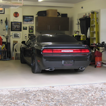 Organized garage with storage racks and Dodge Challenger - Mark from Brookville, NY