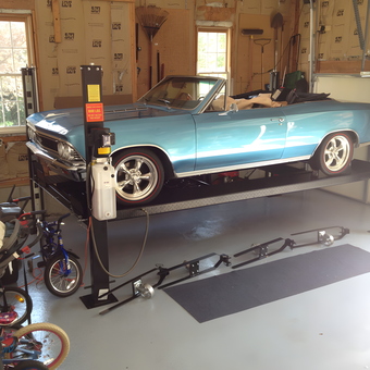 Classic car on four post lift in organized garage - Greg from Marshfield, MA