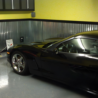 Black Corvette in Modern Garage with Metal Wainscoting - Hugh