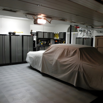Organized garage with cabinets, bike rack, and covered car - Fuelburner from Cary, NC