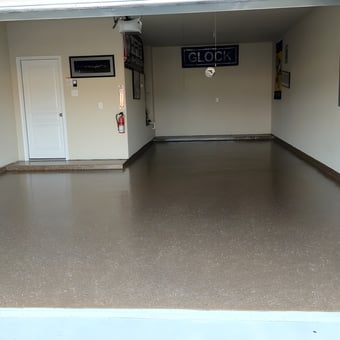 Clean garage with epoxy floor and wall decor - Robert from Spring, TX