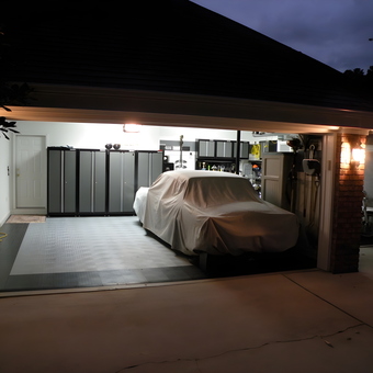 Organized garage with cabinets, car cover, and flooring - Fuelburner from Cary, NC