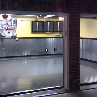 Organized Garage With Metal Wainscoting and Cabinets - Hugh