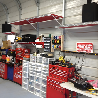 Organized garage with red tool chests and storage bins - Carlos from Paterson, NJ